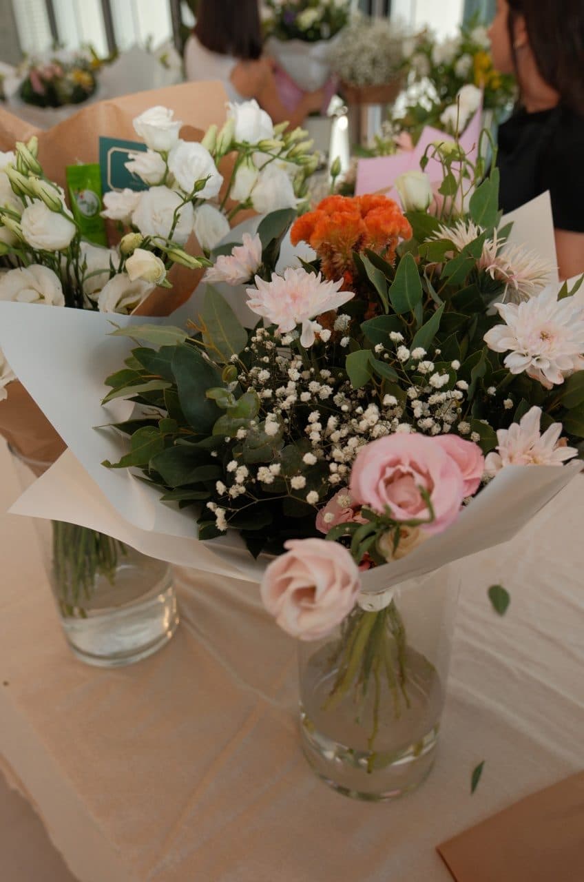 Two bouquets on a florist's work table