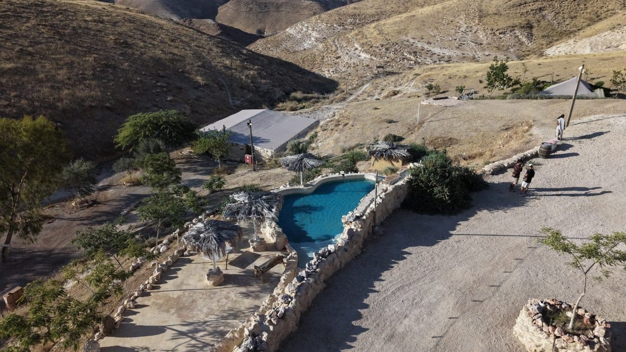 Drone view of a desert pool venue by day